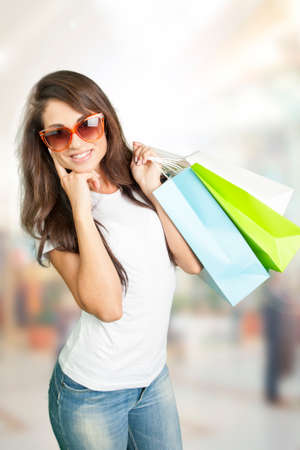 Beautiful woman with shopping bagsの写真素材