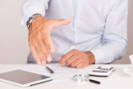 Businessman extending hand to shakeの写真素材