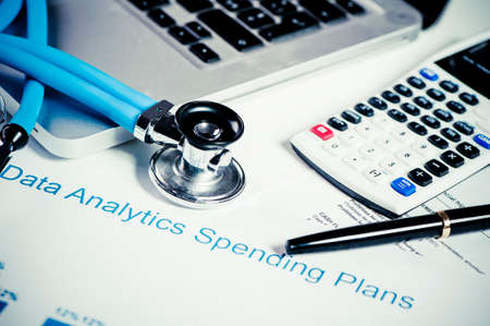 Stethoscope and financial chartsの写真素材