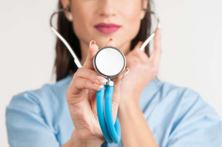 Medical doctor showing stethoscopeの写真素材