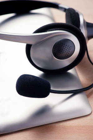 Headset and tablet on desk in call centerの写真素材