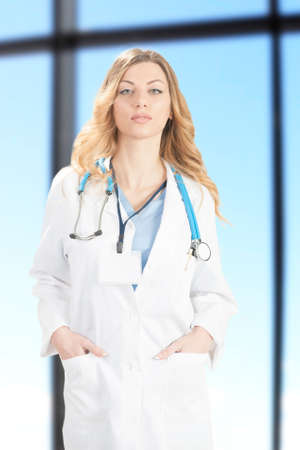Young blond doctor at work in hospitalの写真素材