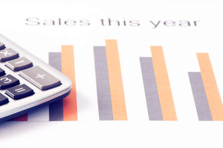 Financial graphs  with calculatorの写真素材