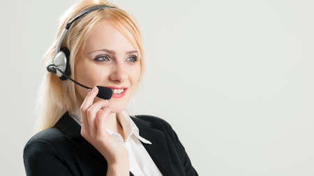 Stock Photo - Portrait of customer service and call center operator woman isolated on white...