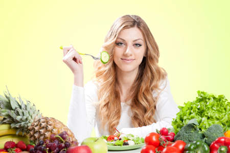 pretty woman eating saladの写真素材