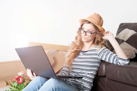 young woman sitting on the floor in a new home