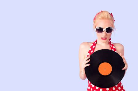 Pin-up girl holding a vinylの写真素材