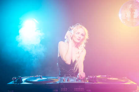 DJ girl on decks on the partyの写真素材