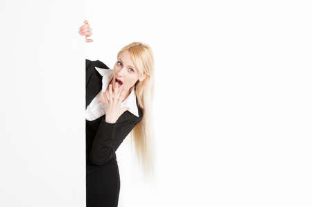 Blonde businesswoman with a big poster isolated on white background