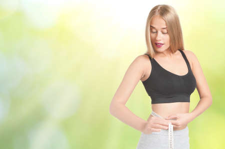 Portrait of young and healthy woman as dieting conceptの写真素材