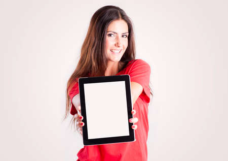 Young woman showing a tablet PC. Your textの写真素材