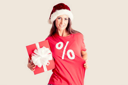 Holidays, sale, christmas and shopping concept - woman holding a gift