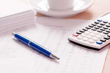 Papers and pen on the tableの写真素材