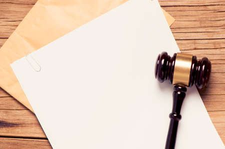 Gavel on a empty paperの写真素材