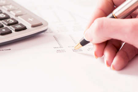 Financial data analyzing. Counting on calculator