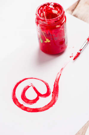 mail sign drawing with red paint. Web conceptの写真素材