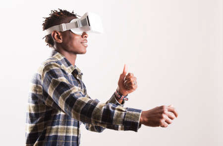 Young man using 3D Virtual Reality Simulator