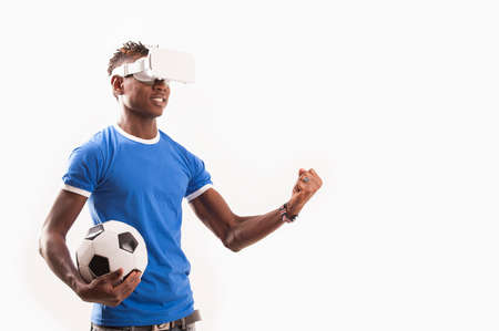 Young man using 3D Virtual Reality Simulatorの写真素材