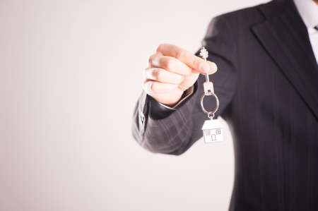 Real estate agent handing over house keysの写真素材