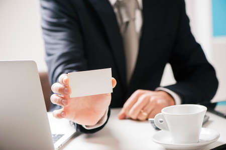 Business man offering card