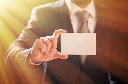 Business man offering card