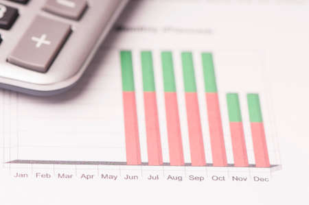 Financial paper charts and graphs on the table