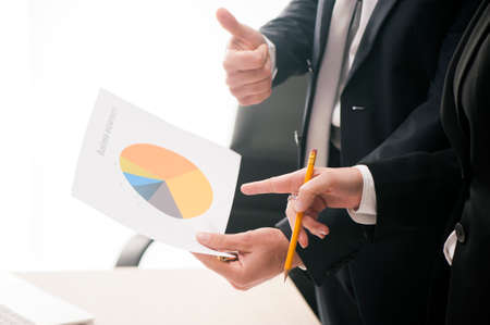 Business people during paperwork at meetingの写真素材