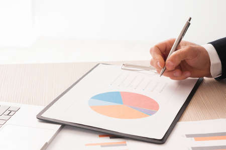 Business growth. Close up of business mans hand in the officeの写真素材