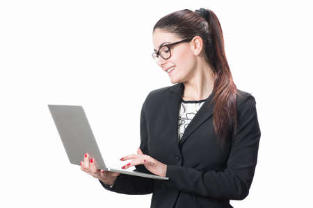 Isolated young business woman with laptopの写真素材