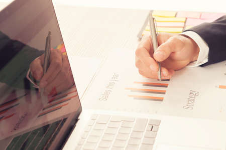 Business man working at meeting with charts