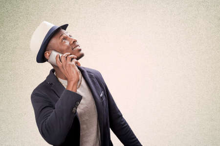 Afro american young man talking on the phoneの写真素材