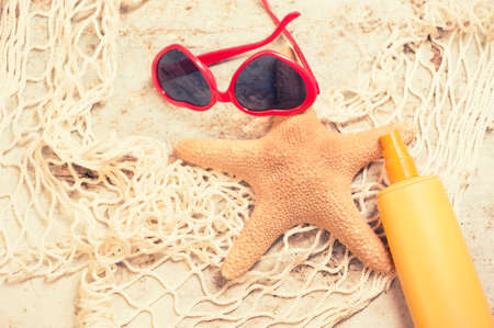 Beach on sunny day with wooden walkway and beach accessoriesの写真素材