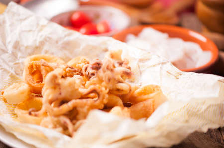 Crispy calamari rings on wooden tableの写真素材