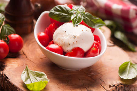 Caprese salad with baby mozzarella cheese
