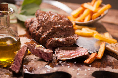 Delicious beef steakes on woodの写真素材