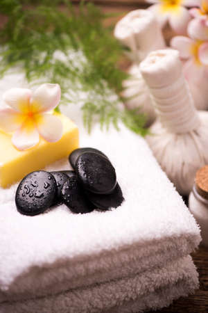 Spa stones with towel and plumeriaの写真素材
