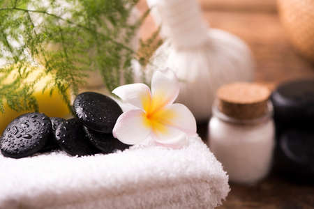 Spa stones with towel and plumeria