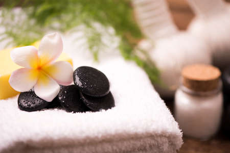 Spa stones with towel and plumeriaの写真素材