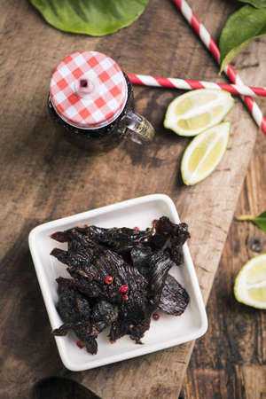 Beef Jerky on wooden backgroundの写真素材