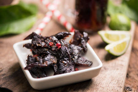 Beef Jerky on wooden backgroundの写真素材