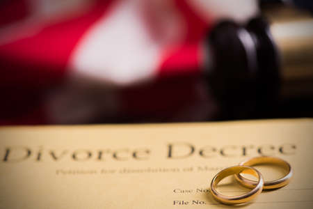 Divorce decree and gavel on a table.の写真素材