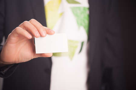Reduce Reuse Recycle. Businessman Holding A White Card With Textの写真素材