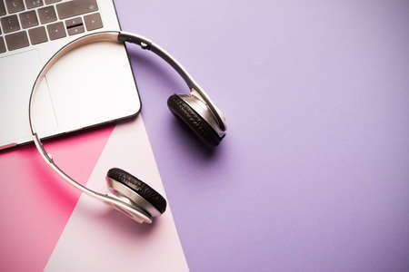 headphones and laptop computer closeup. online music concept.の写真素材