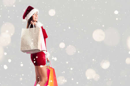 Santa Woman With Shopping Bagsの写真素材