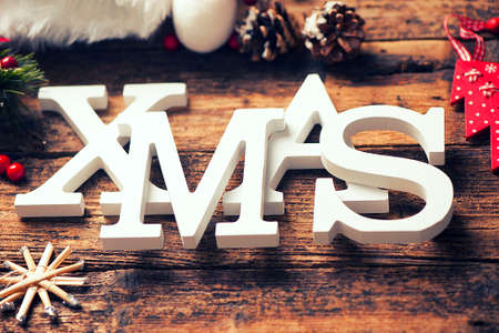 White wooden xmas word on wooden tableの写真素材