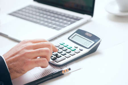 Businessman using calculatorの写真素材