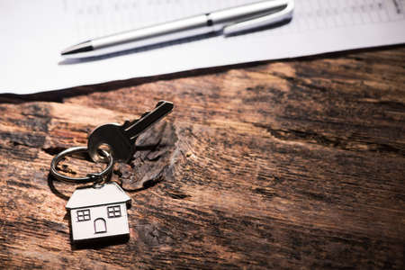 House key on a wooden tableの写真素材