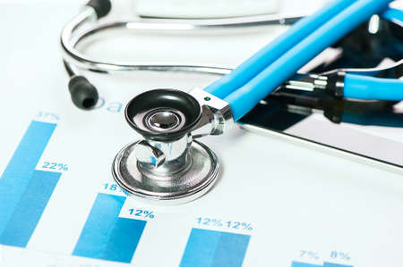 stethoscope on financial chartsの写真素材