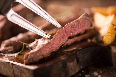 Closeup of a slice of beef steakの写真素材