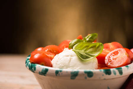 Caprese Salad. Mozzarella Cheese salad with tomato and basilの写真素材